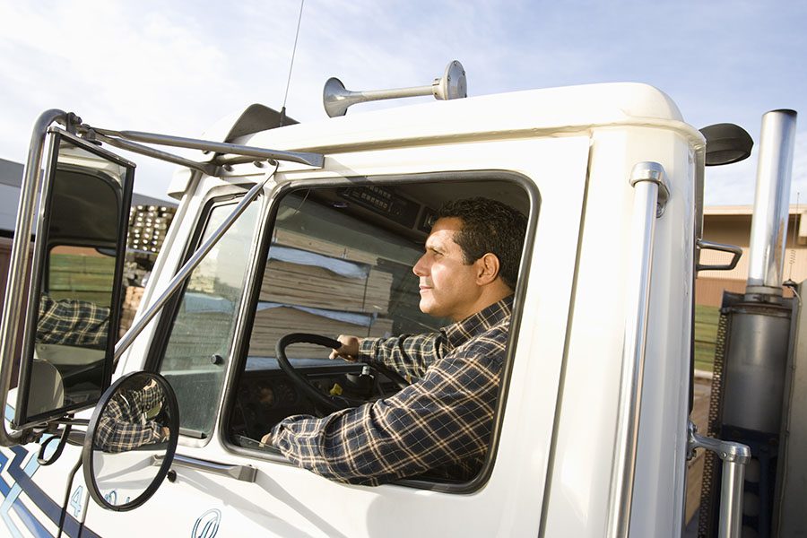 Business Insurance - View Of Truck Driver Driving His Truck